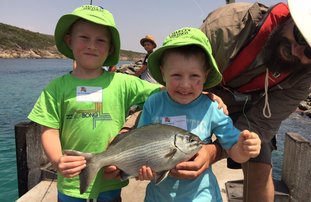 Kids enjoying a free school holiday fishing clinic